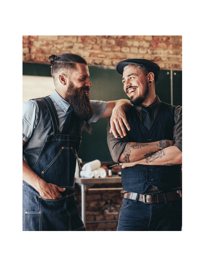 two employees laughing